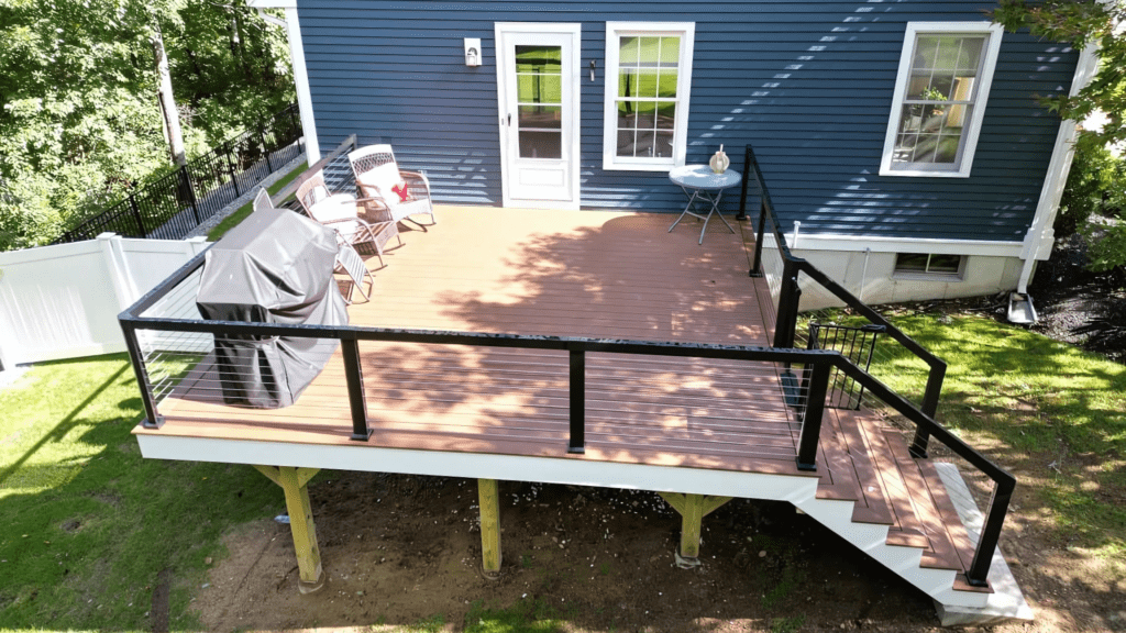 Beautiful outdoor wooden deck installed by D&G Exteriors in Malden, MA