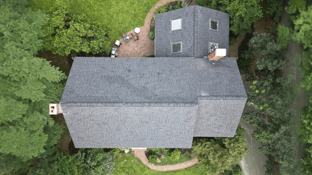 Aerial view of a house with a new roof installed by D&G Exteriors in Malden, MA