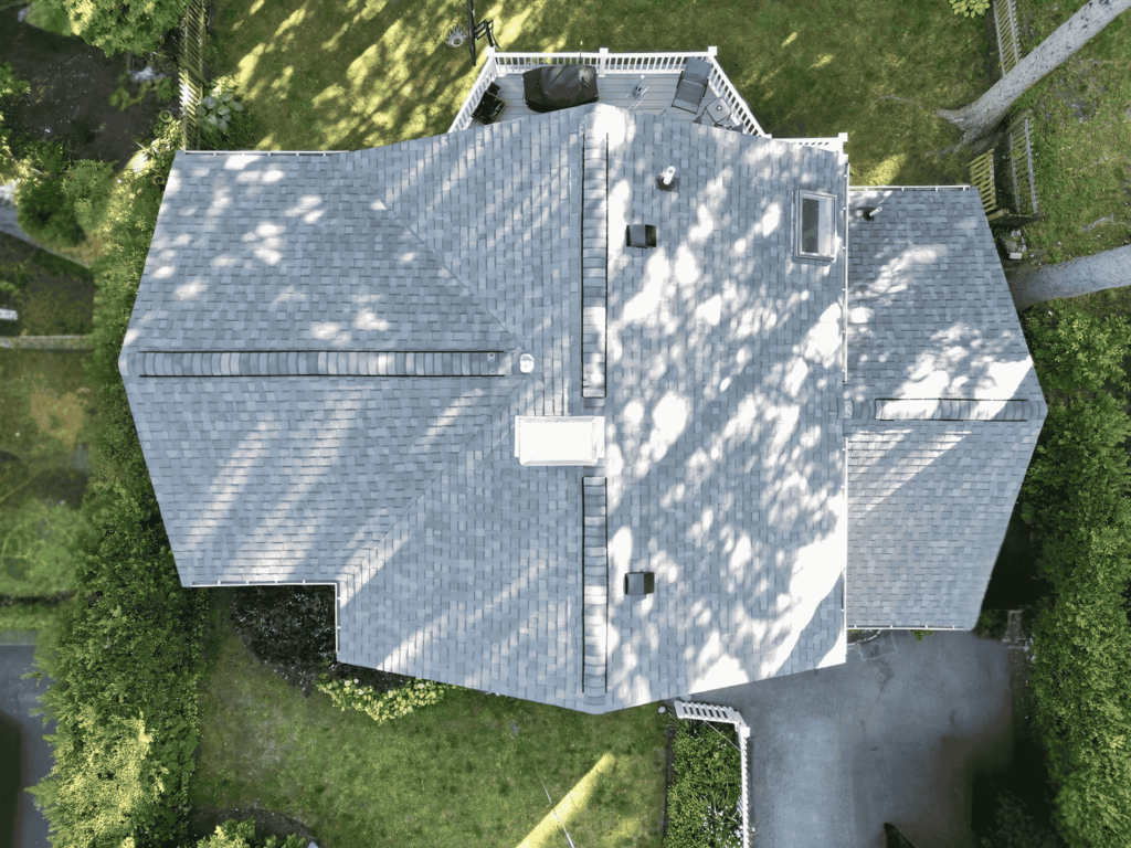 Aerial view of a residential roof with high-quality shingles, showcasing D&G Exteriors' expert roofing services in Malden, MA.