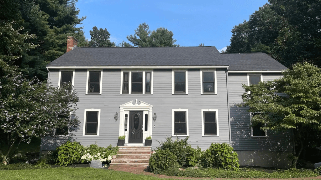 House with modern blue siding installed by D&G Exteriors in Malden, MA