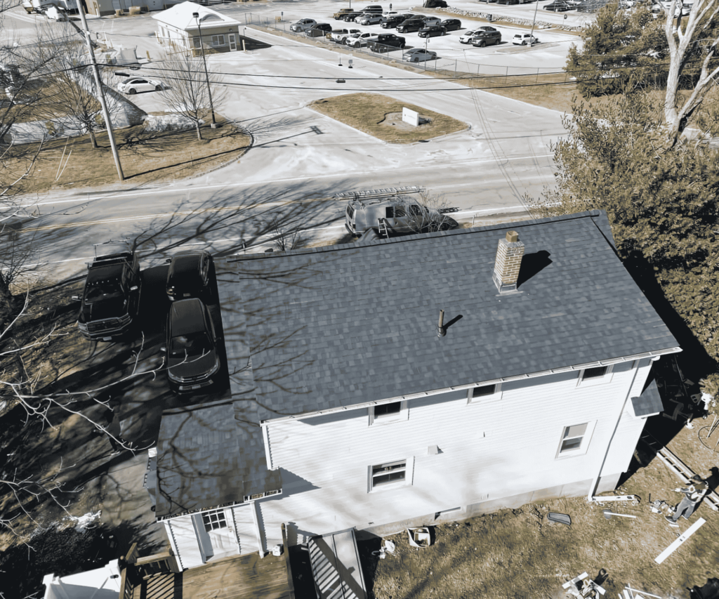 A bird’s-eye view of a newly installed roof in Suffolk County, highlighting the craftsmanship of D&G Exteriors.