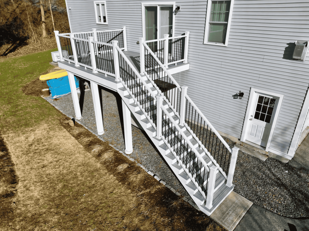 A well-crafted deck featuring railings, providing a comfortable outdoor space in Medford, MA.