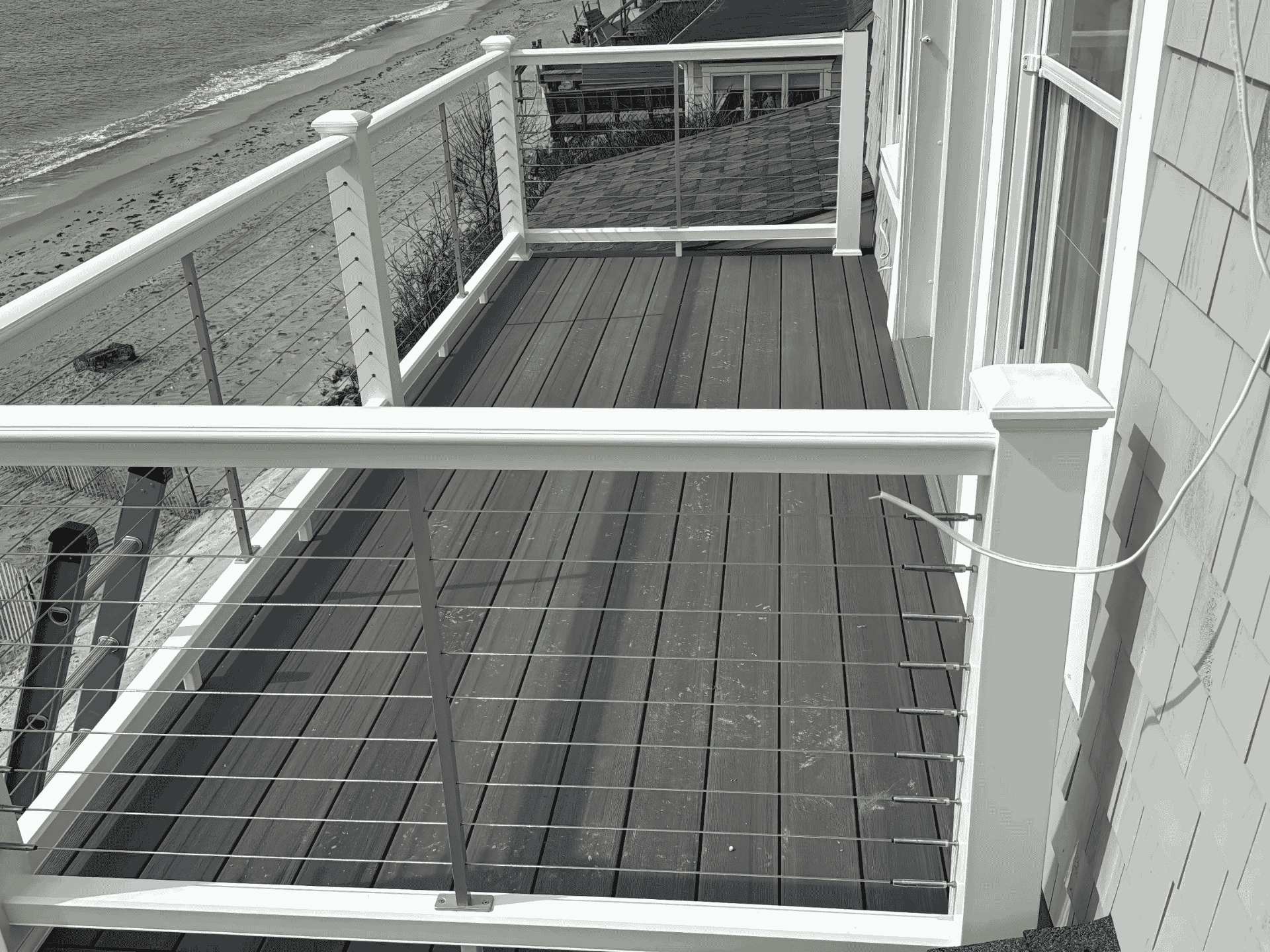 Custom-designed deck by D&G Exteriors in Somerville, MA, featuring durable materials and modern railings.