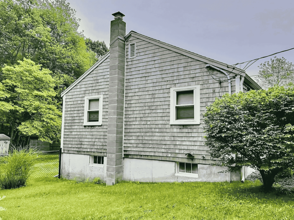 A residential building with newly installed siding, improving energy efficiency and exterior durability.