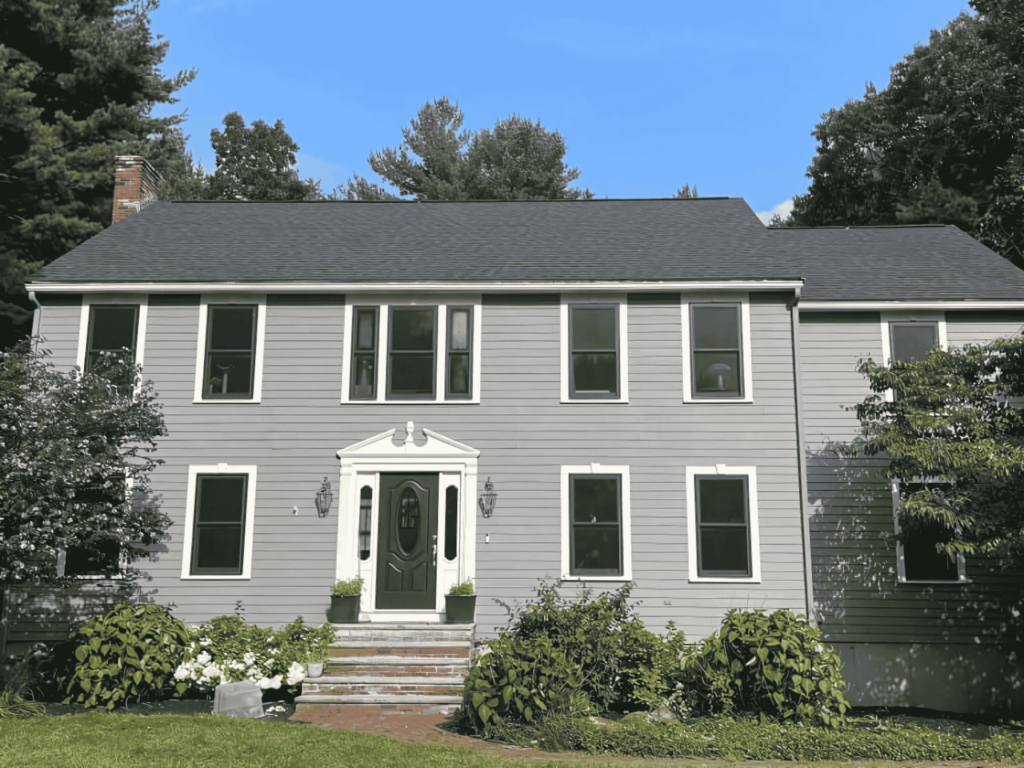 A beautifully updated home exterior with high-quality siding installed by D&G Exteriors in Medford, MA.