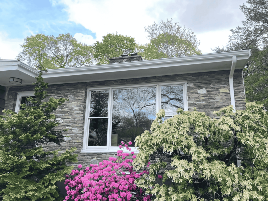 A house with newly installed large windows, bringing in natural light and energy efficiency.