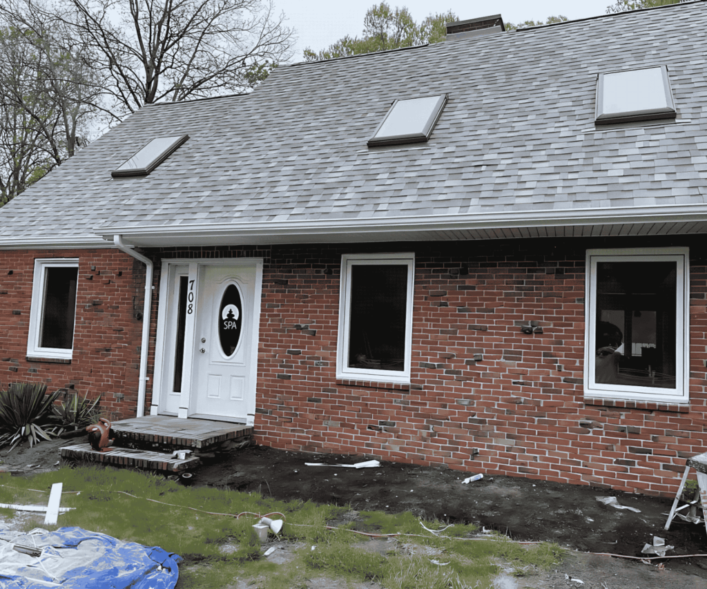 A newly installed window offering a clear and stylish look for a home in Medford, MA by D&G Exteriors.