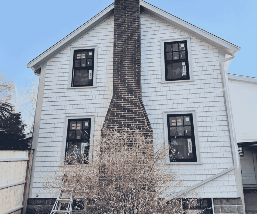 Newly installed energy-efficient windows on a residential property in Lynn, MA.