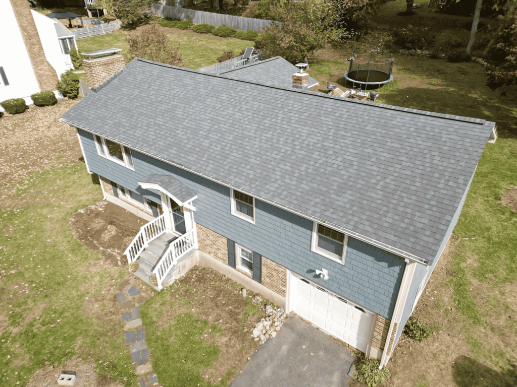 A newly installed roof on a beautiful home in Lynnfield, MA, showcasing expert craftsmanship by D&G Exteriors.