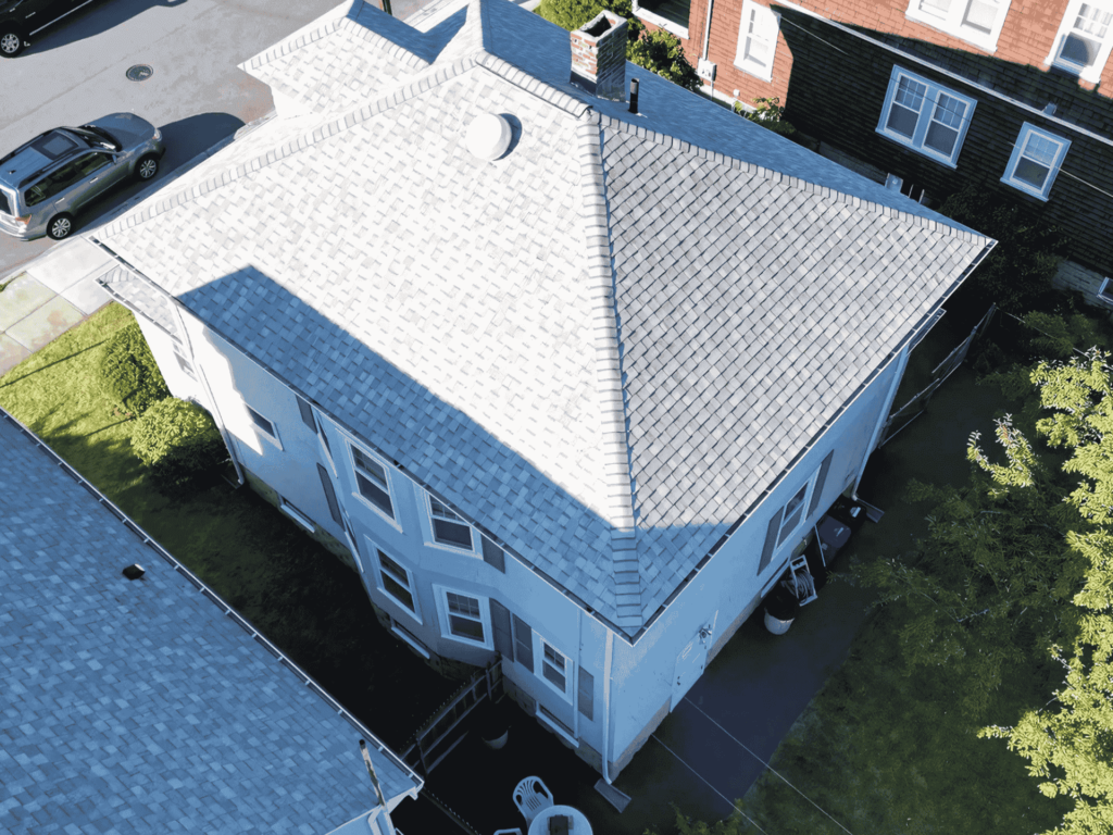 Close-up aerial view of a professionally installed roof in Marblehead, MA, showcasing durable asphalt shingles.