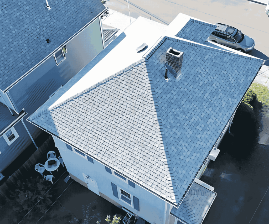 A newly installed roof on a residential home in Medford, MA, showcasing expert craftsmanship by D&G Exteriors.