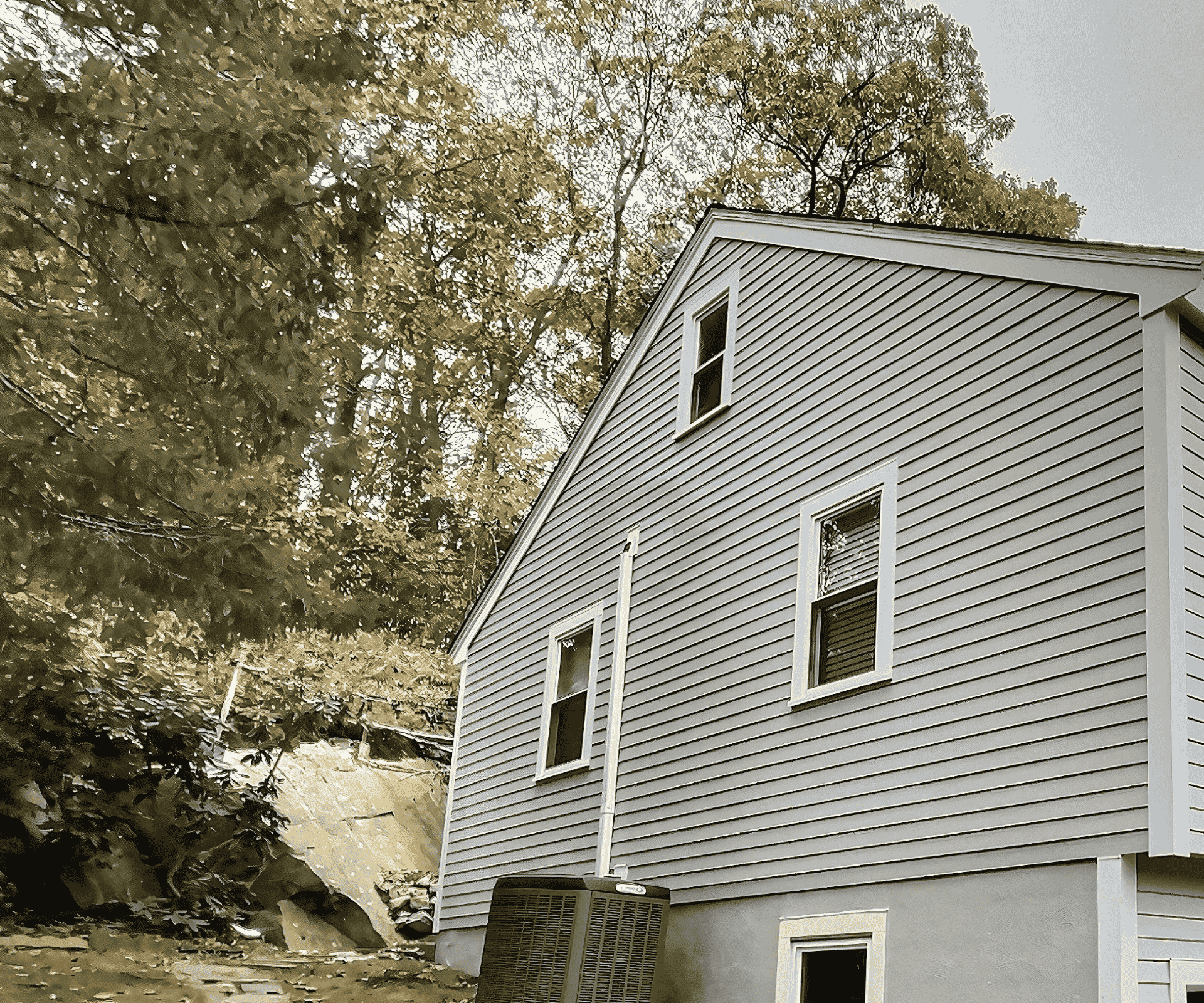 A home with fresh siding installation in Salem, MA, featuring gray panels and white trim.