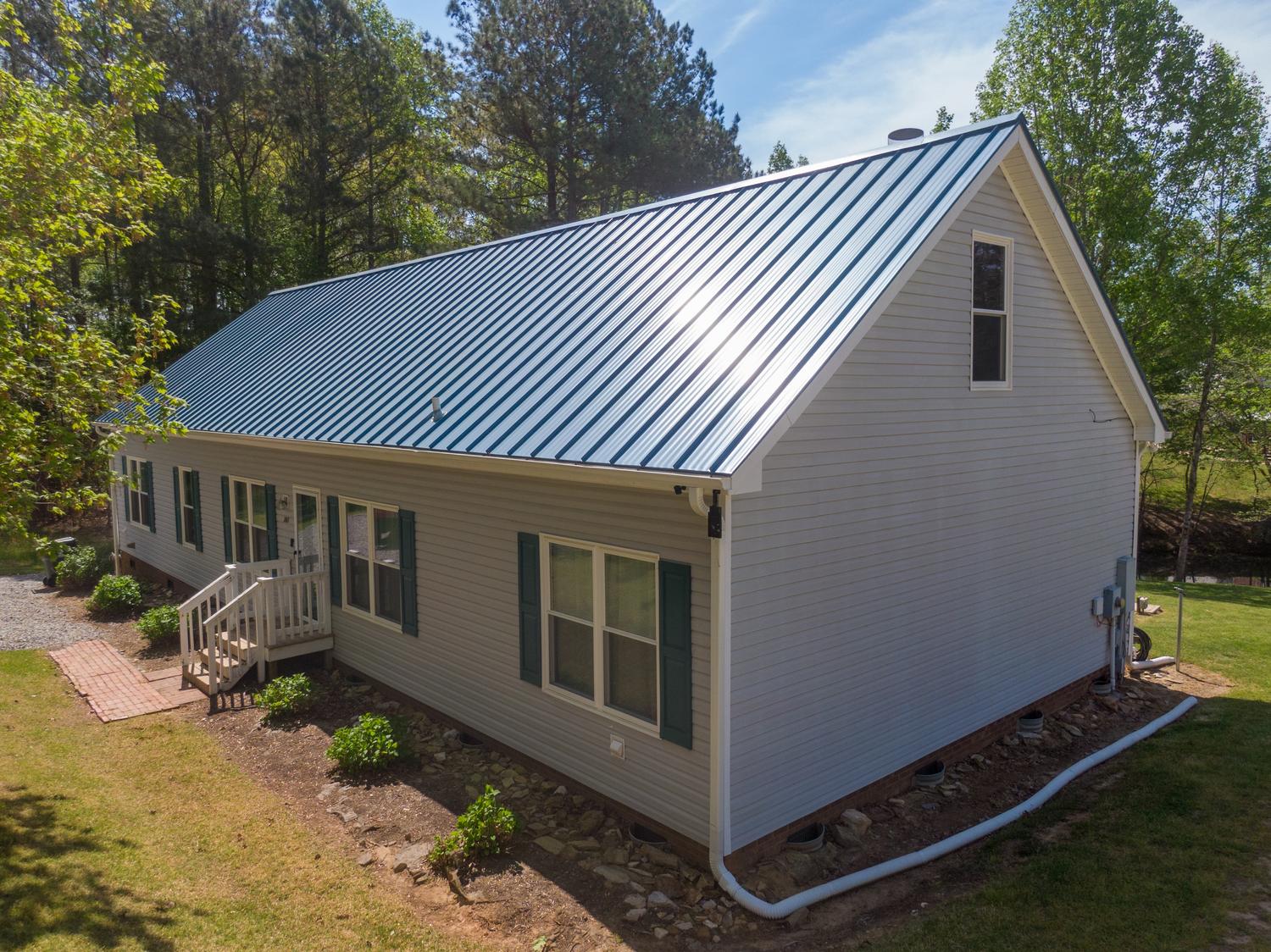 Metal roofer in North Andover, MA installing high-durability roofing systems