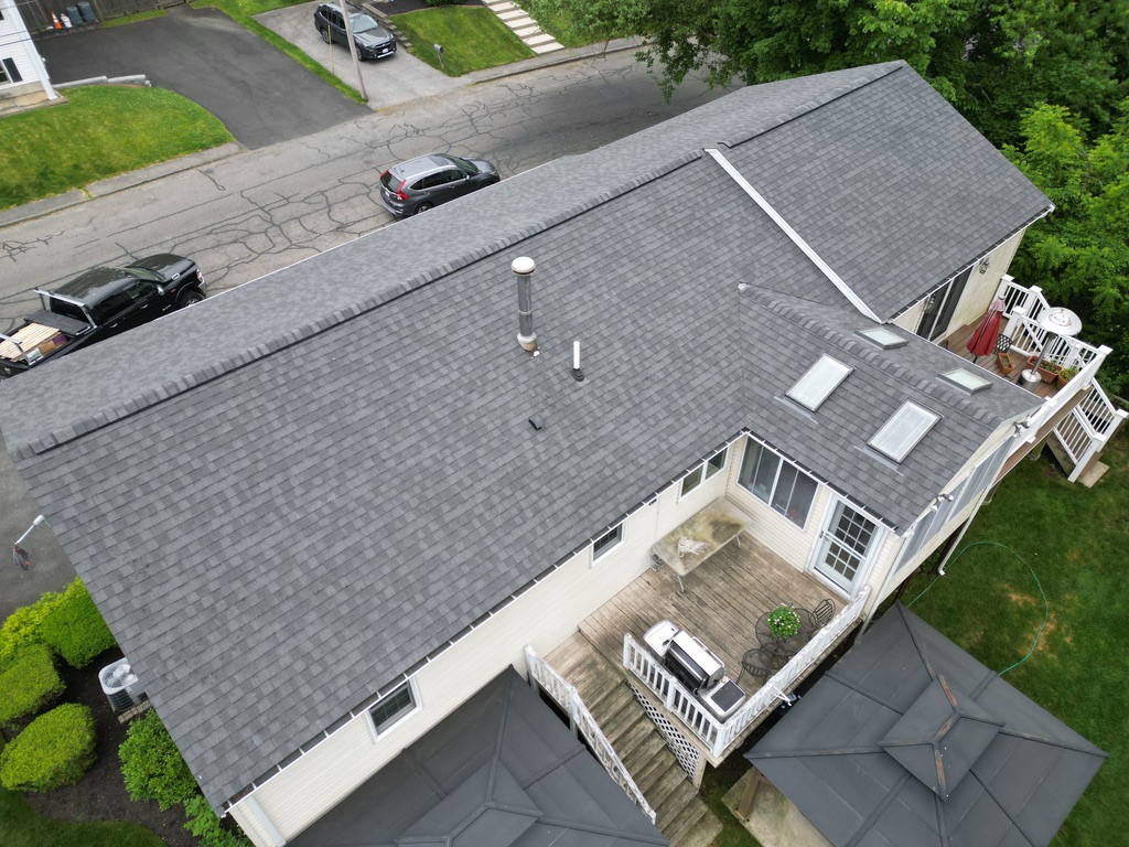 Roof repair services in Norwell, MA restoring roofs after storm damage