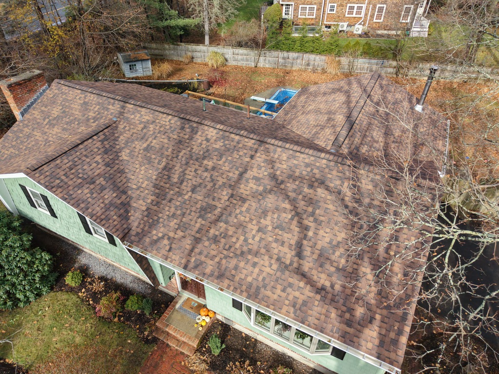 Roof replacement services in Wenham, MA installing durable roofing systems